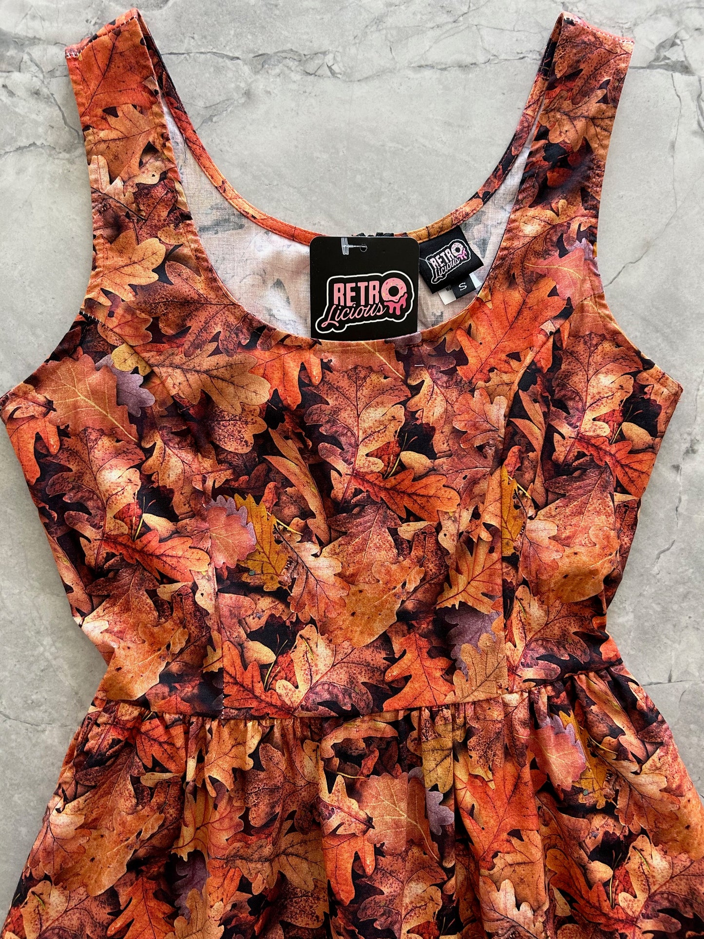 flatlay of front bodice of leaves fit and flare dress