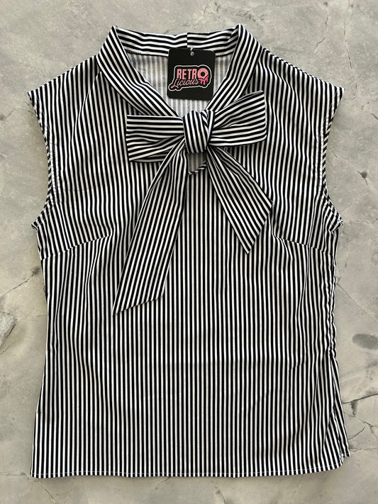 flat lay of black and white striped bow top