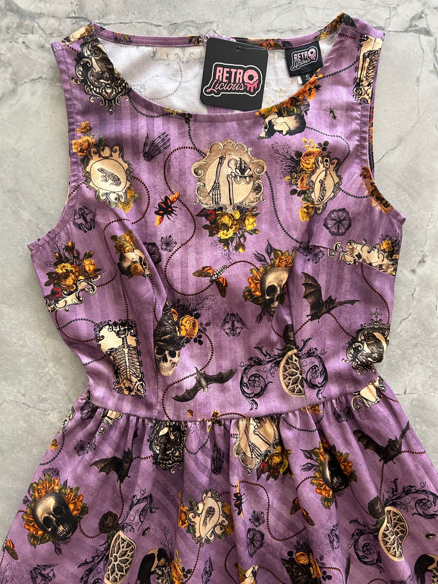 close up of bodice of the purple skull dress