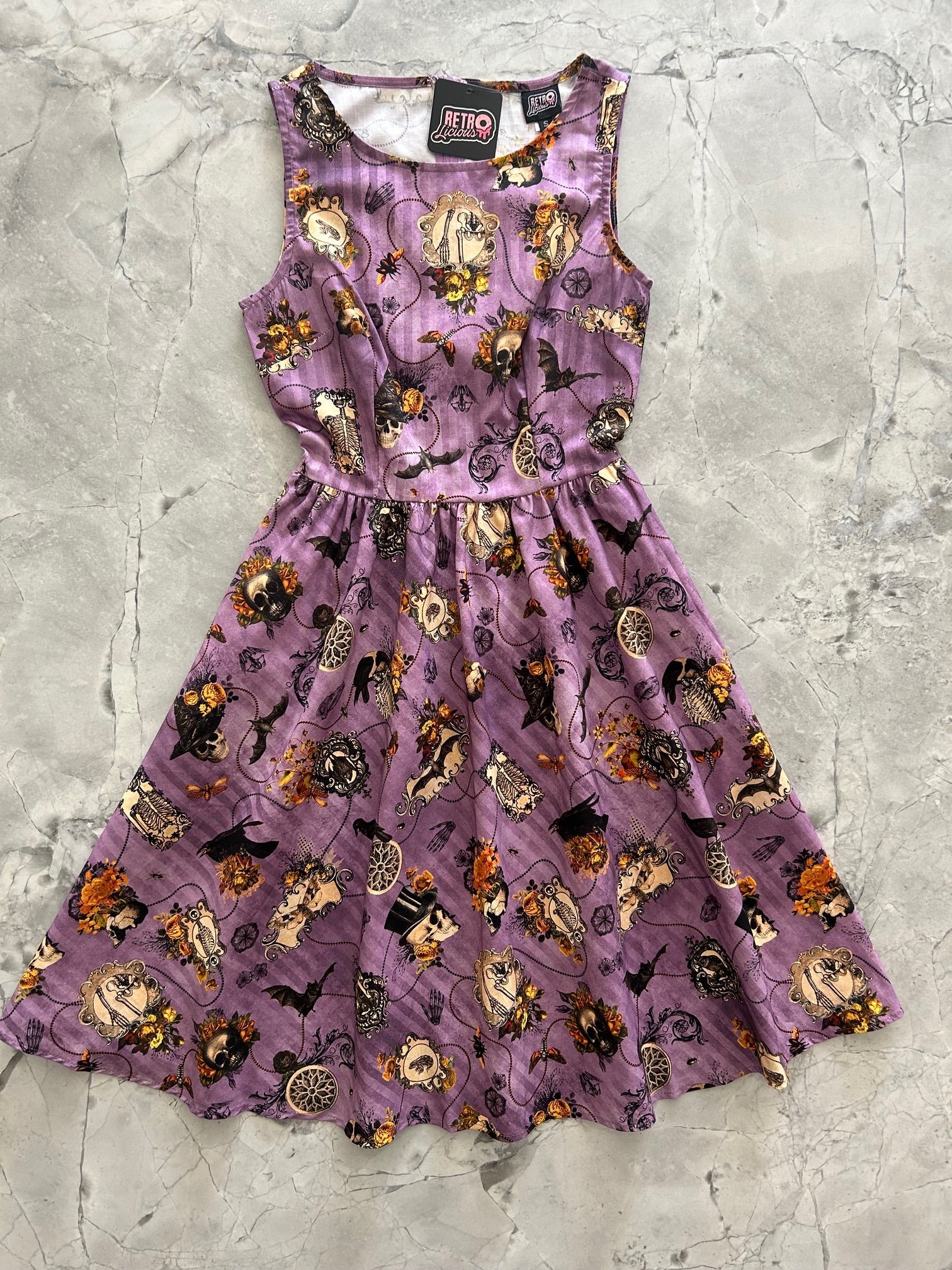 flatlay of purple skull dress