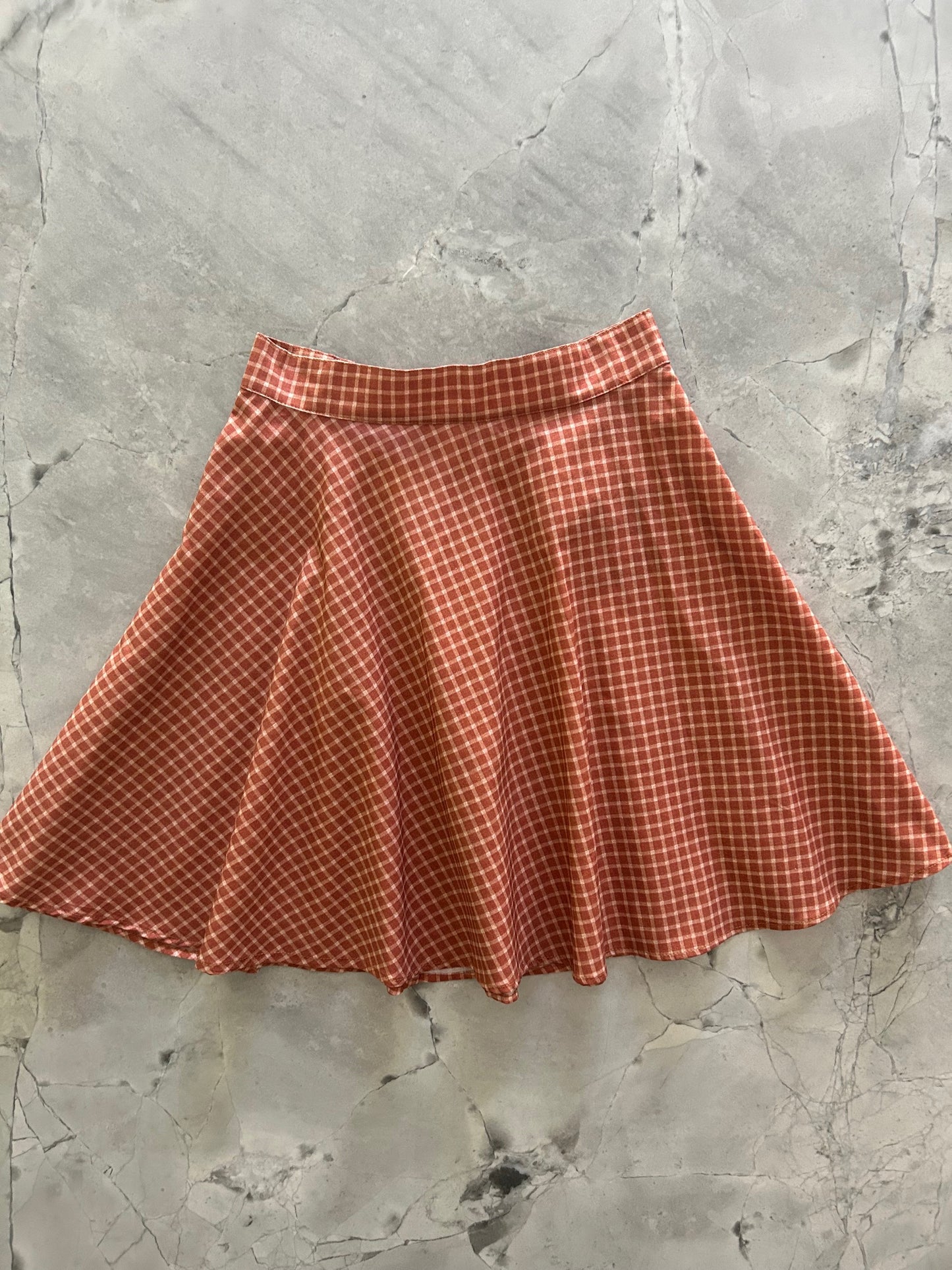 flatlay of checkered skater skirt