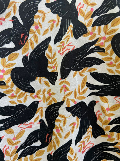 close up of print showing black birds and leaves