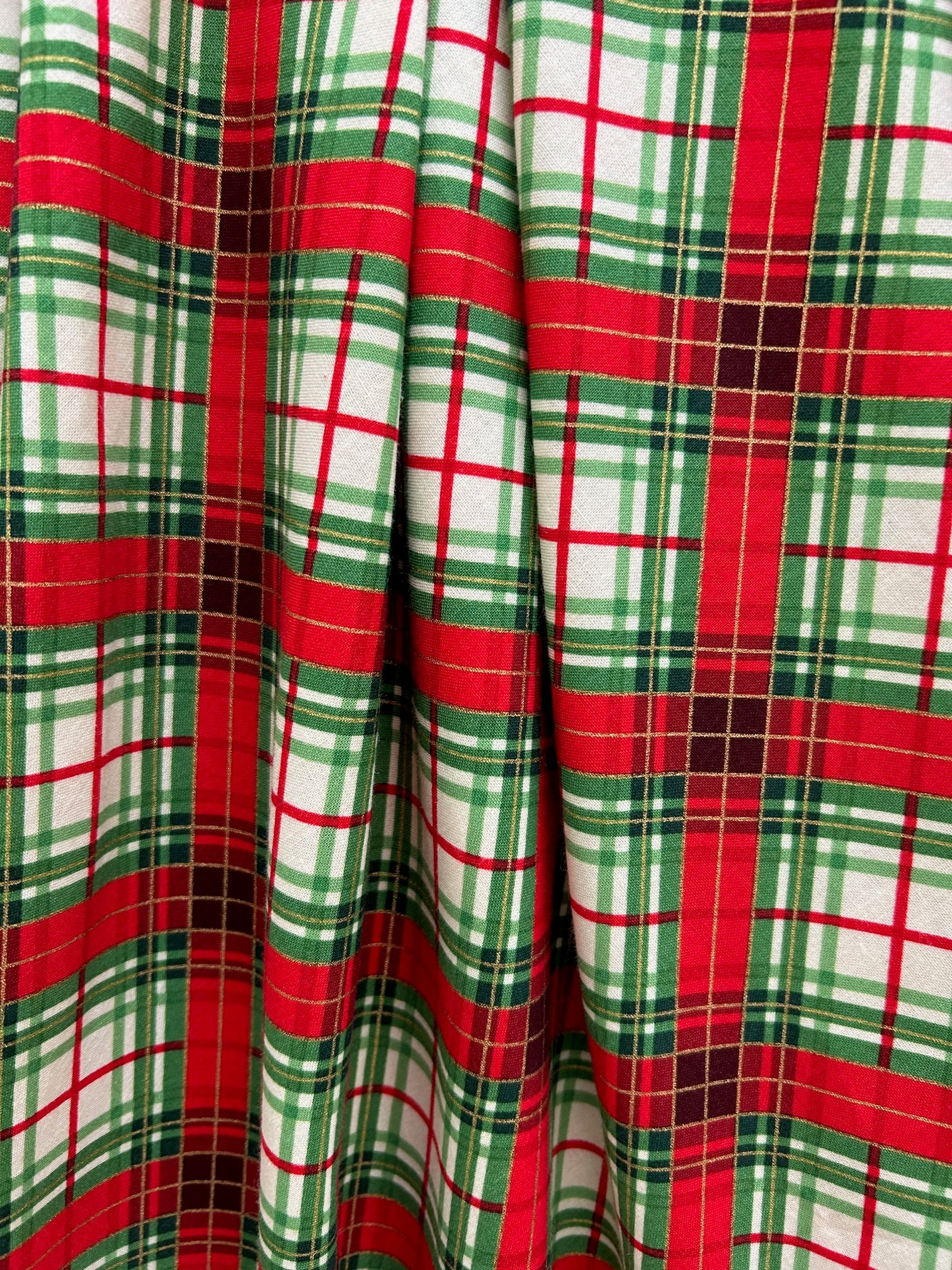 close up of the holiday red and green plaid with gold accents