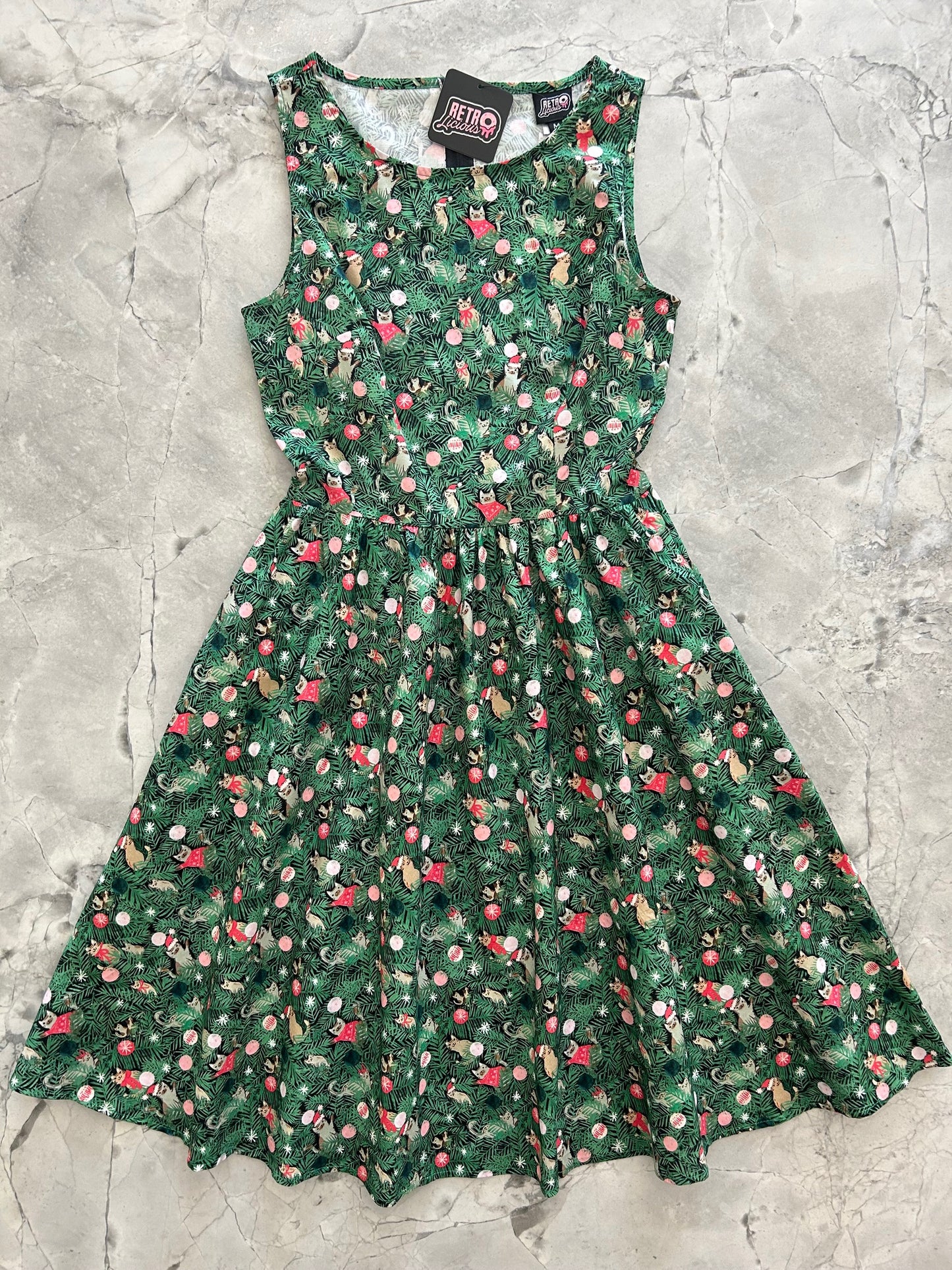 flatlay of holiday cats vintage dress