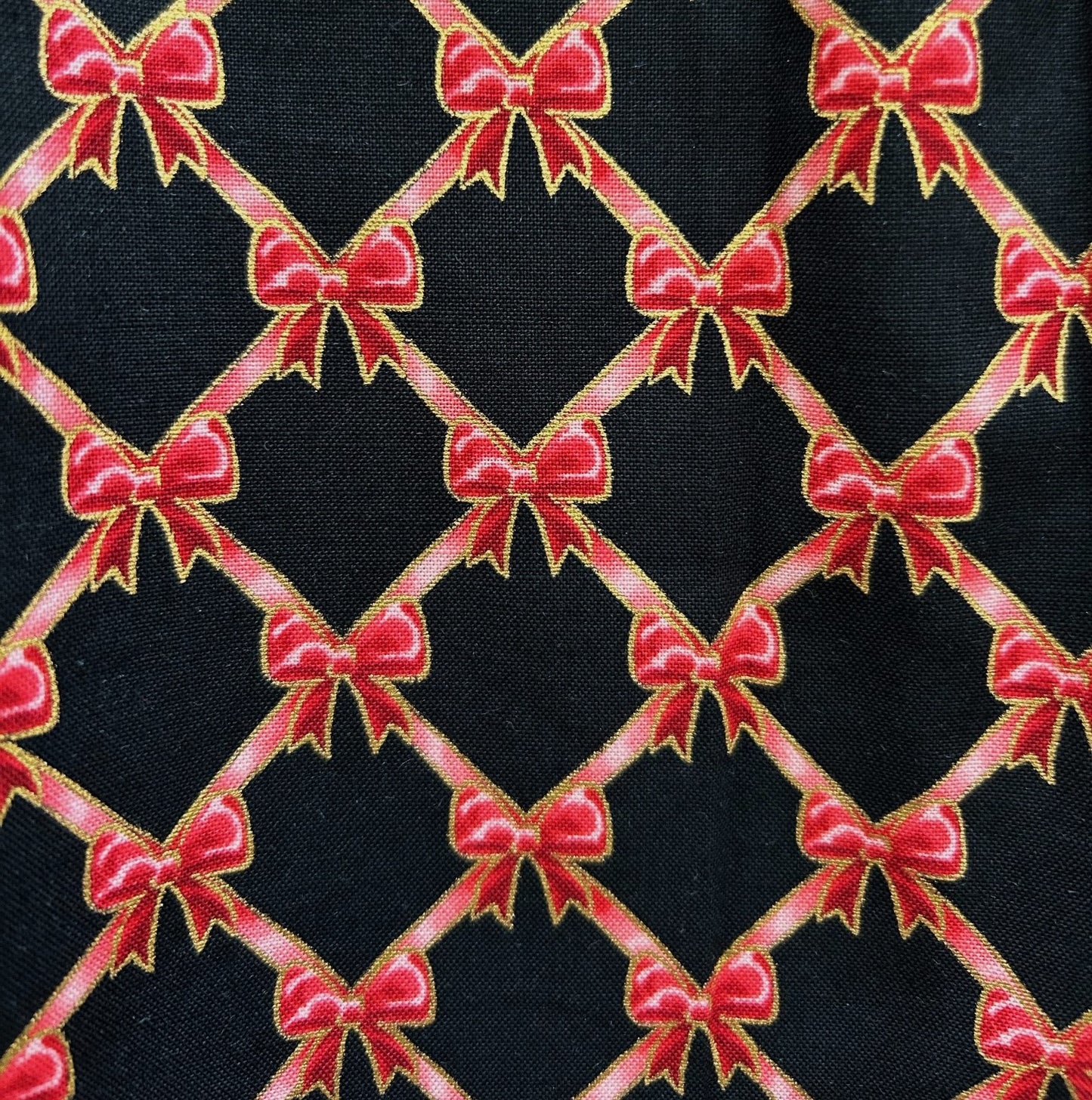 close up of print showing stacked red bows