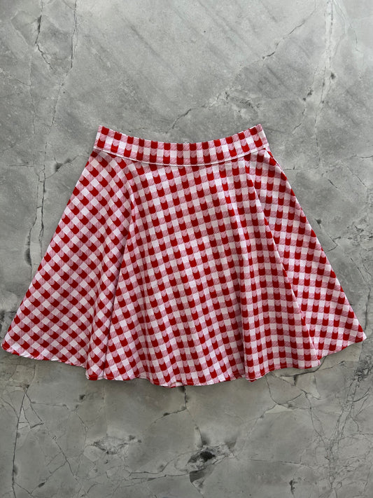 flatlay of red check skater skirt