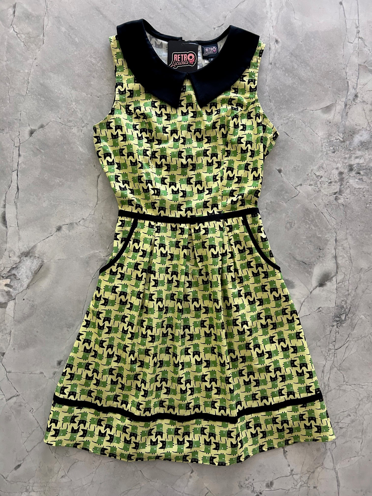 flatlay of the front of the mod cat collared dress