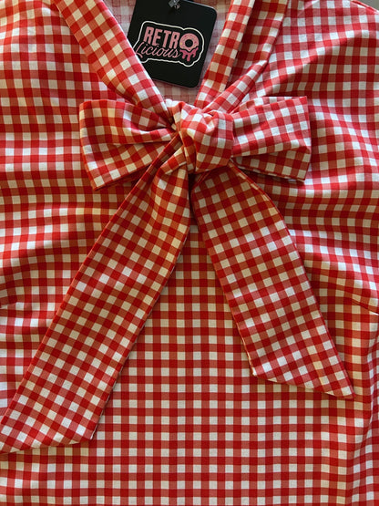 close up of red gingham top showing bow detail