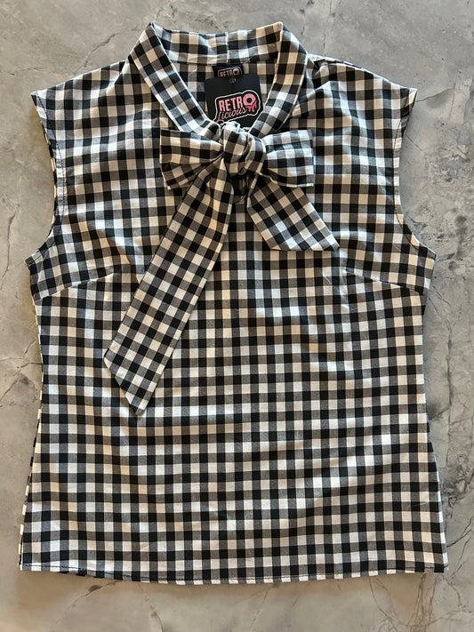 flatlay of black gingham bow top