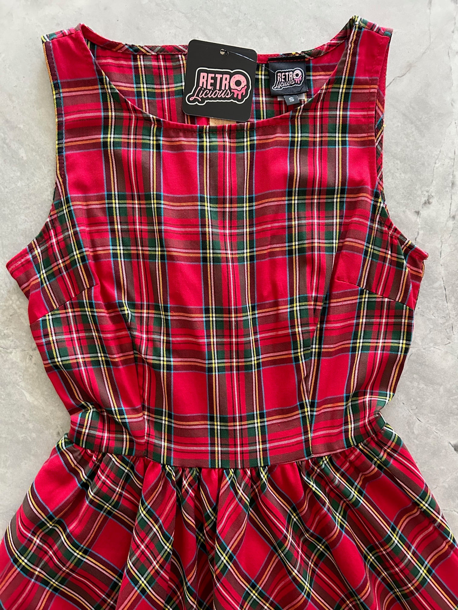 flatlay of bodice of red plaid dress