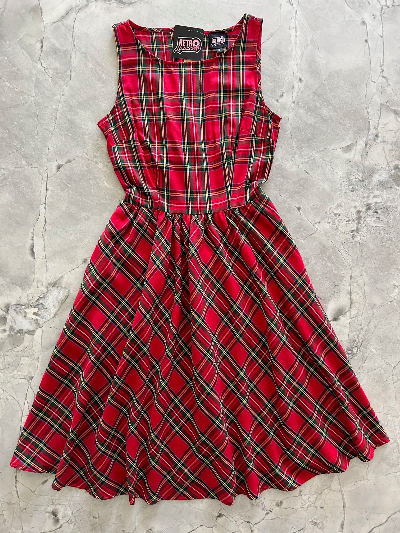 flatlay of red plaid vintage dress