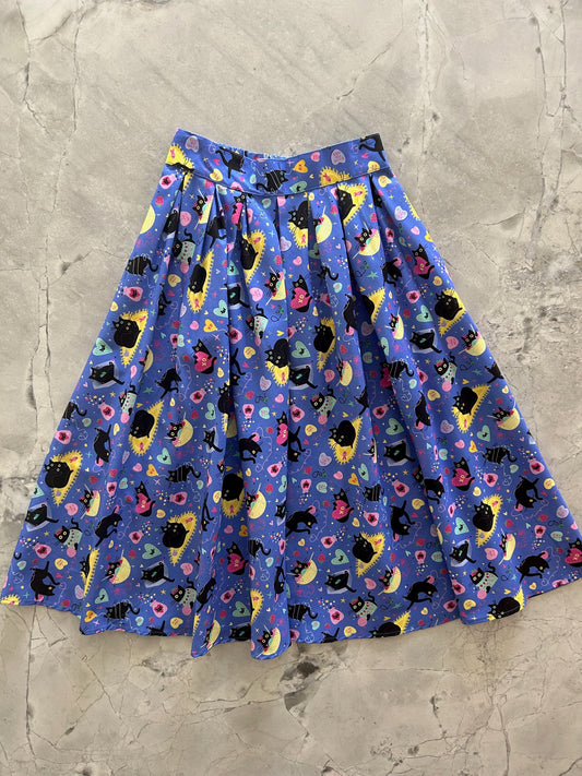 flatlay of purple cat doris skirt