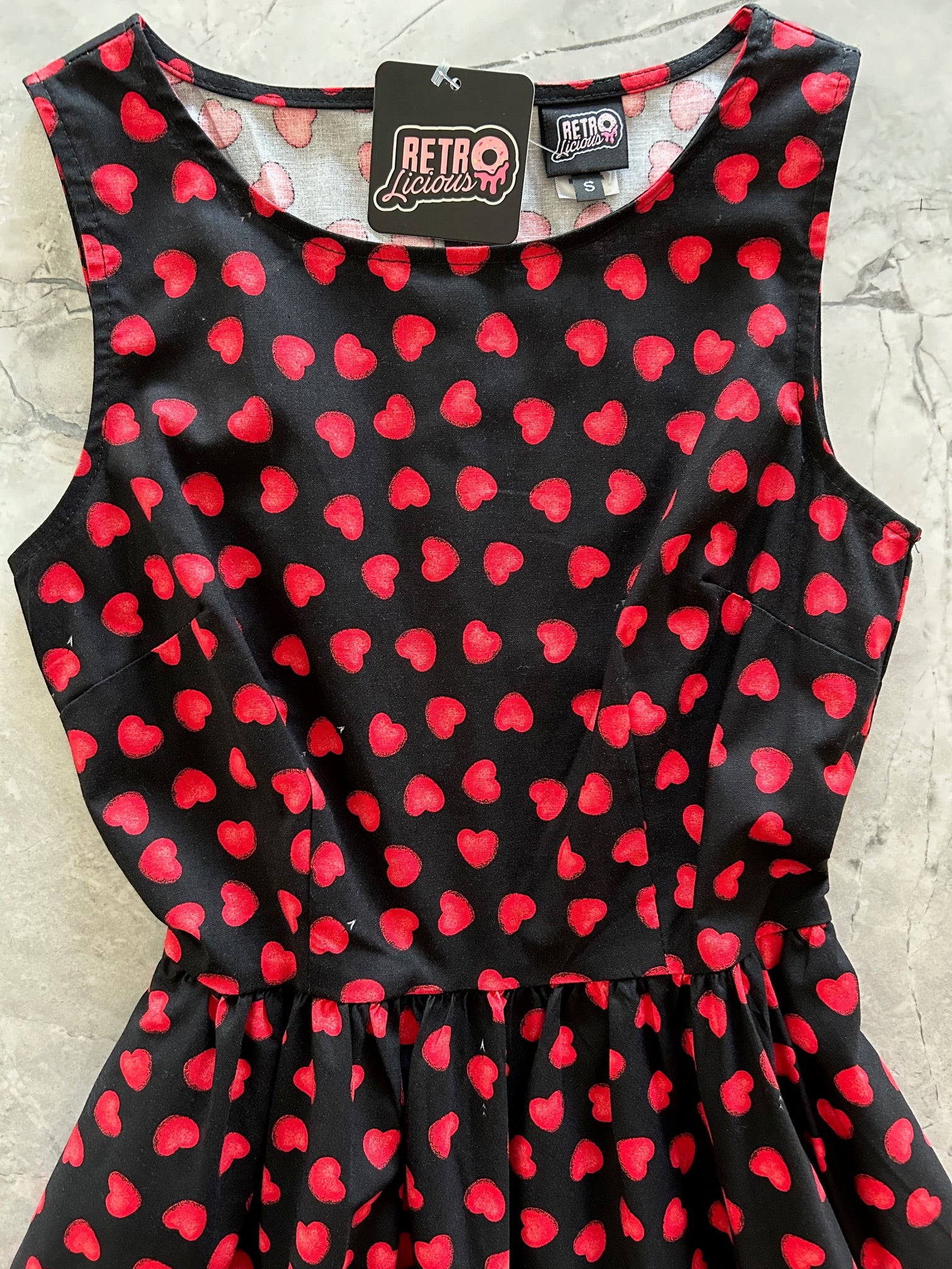 flatlay of bodice of hearts midi dress