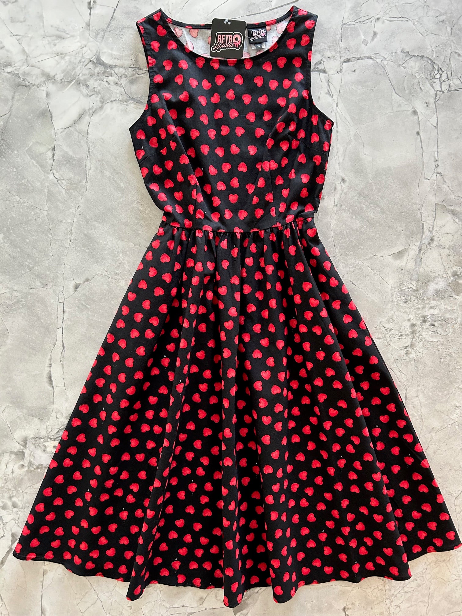 flatlay of hearts midi dress