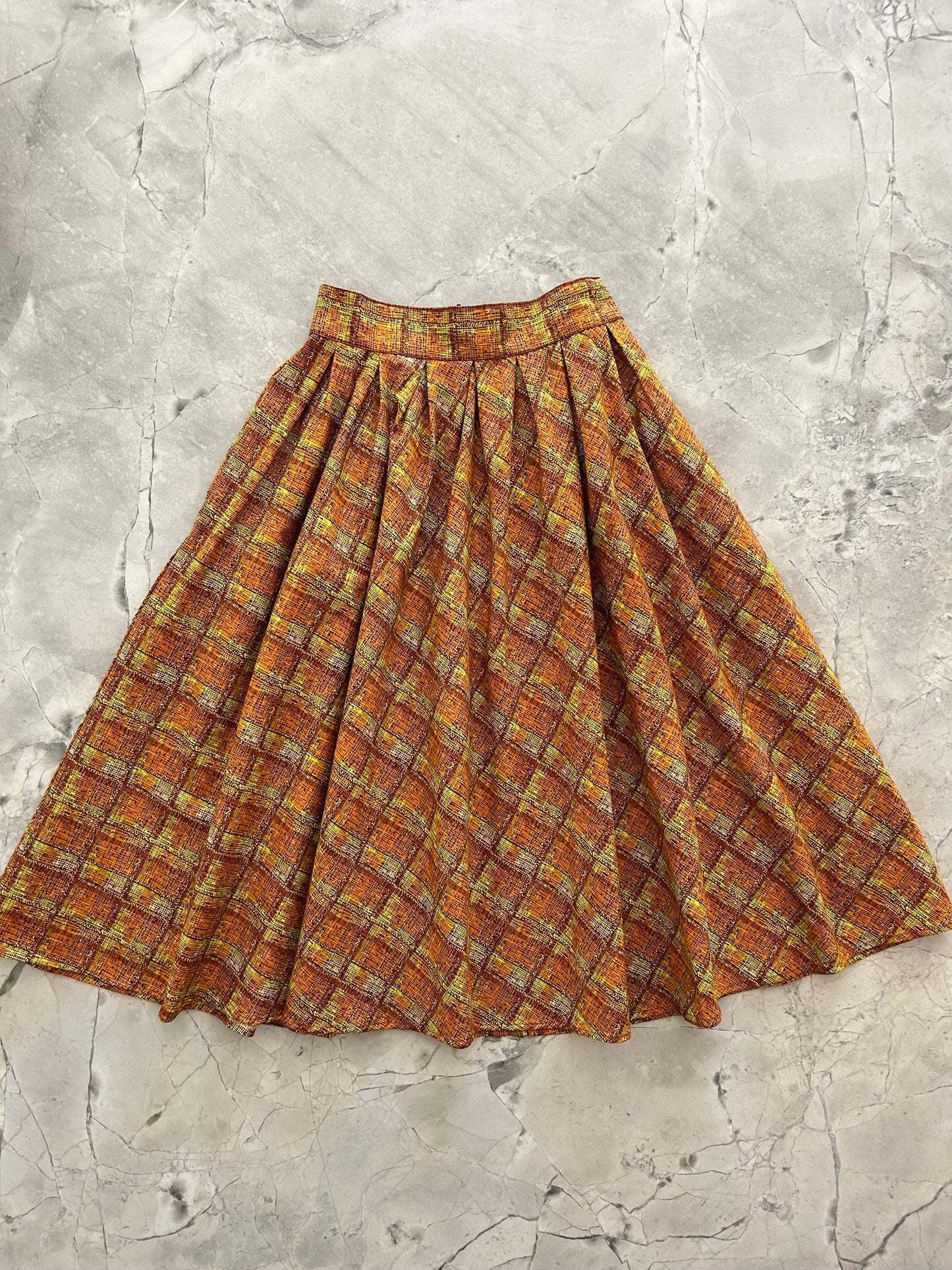 flatlay of doris skirt in rust plaid