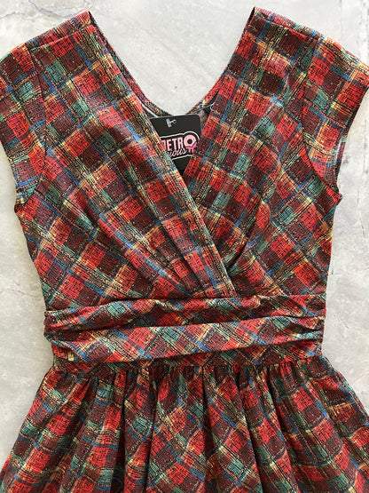 flatlay of close up of holiday plaid greta dress