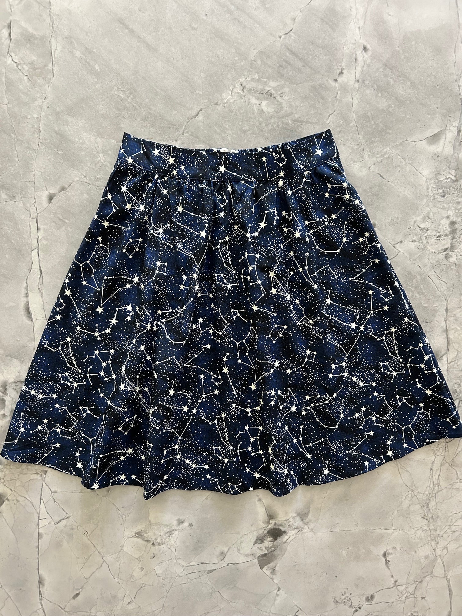 flatlay of constellations glow in the dark skirt