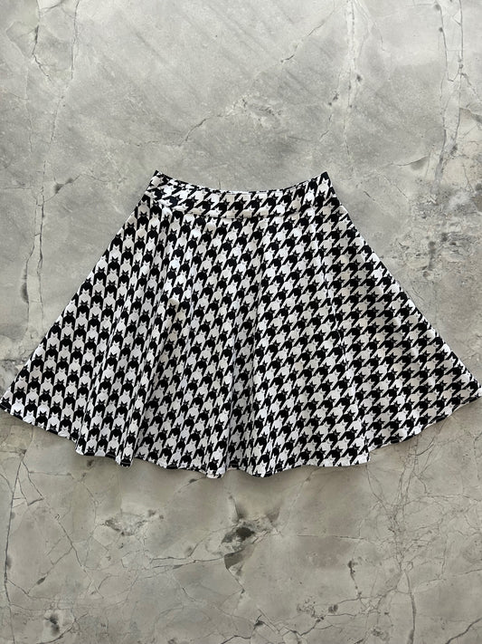 flatlay of houndstooth cats skater skirt