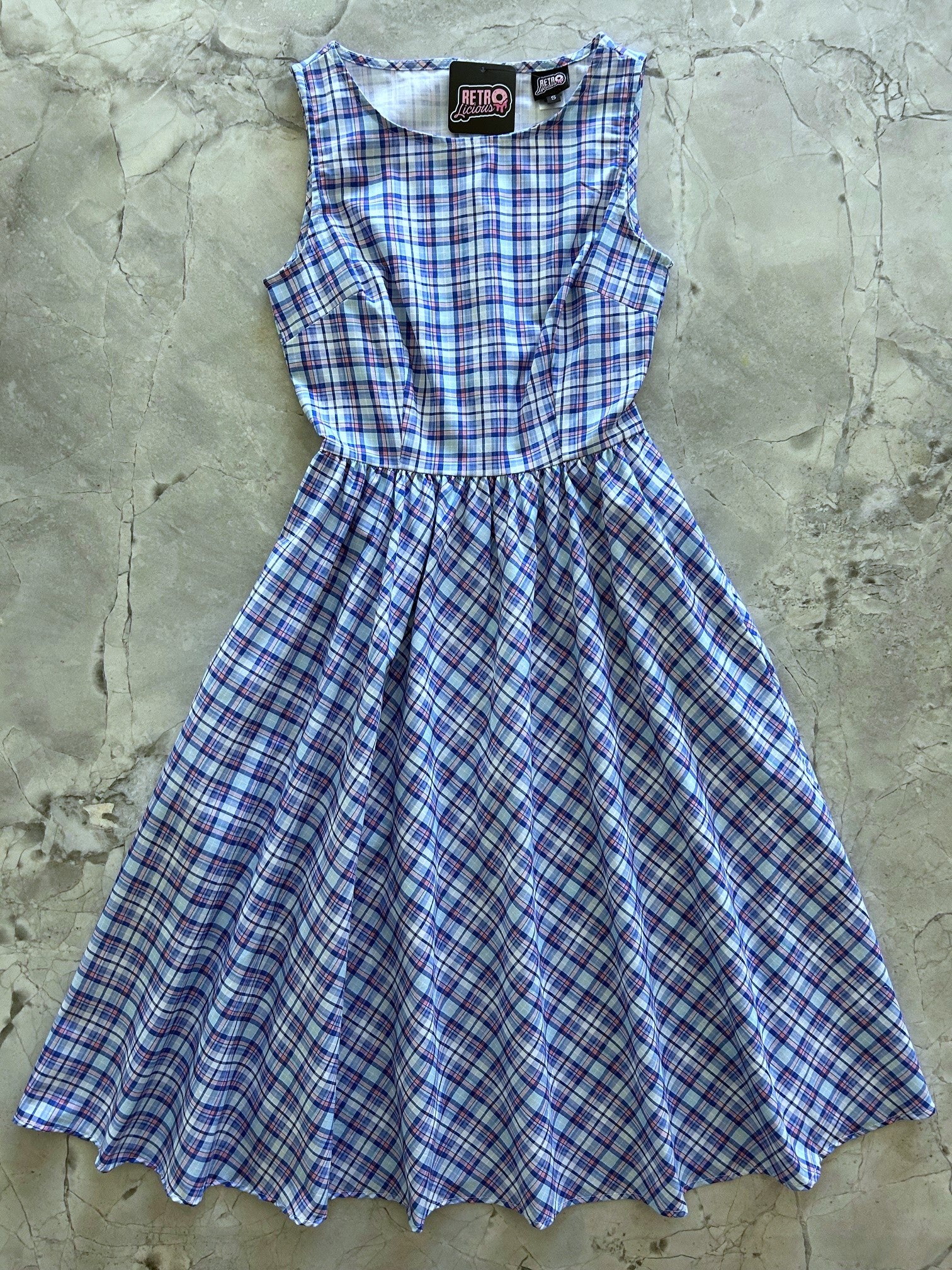 flatlay of blue plaid midi dress