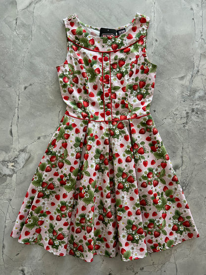 flatlay of elizabeth dress in strawberries